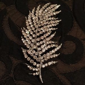 Crystal studded leaf shaped brooch